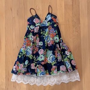 Like new. Worn once. Little girls navy blue floral dress.